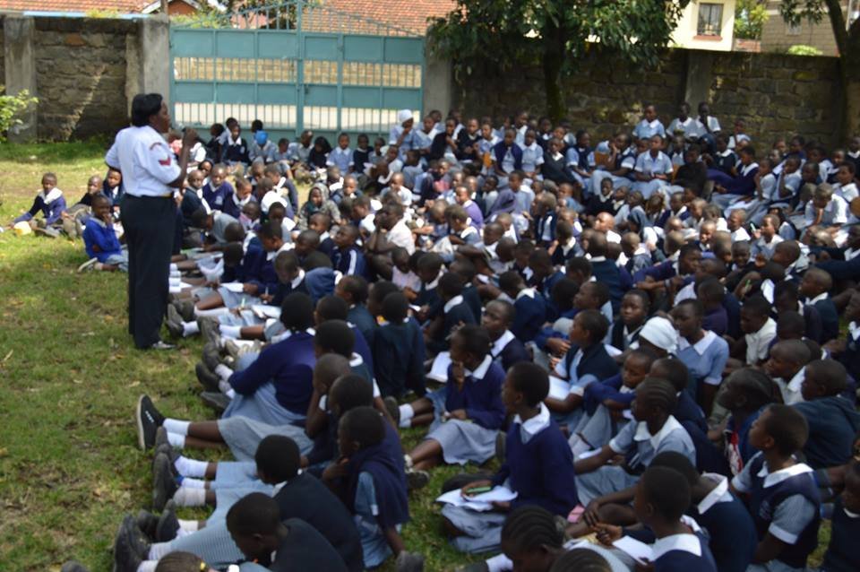 Coporal Beth Kamau from Kaptembwo Police Station gender desk during sensitisation forum on violence prevention at Koinange Primary School.